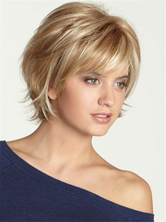 Woman with a blunt ear-length flapper bob and bangs